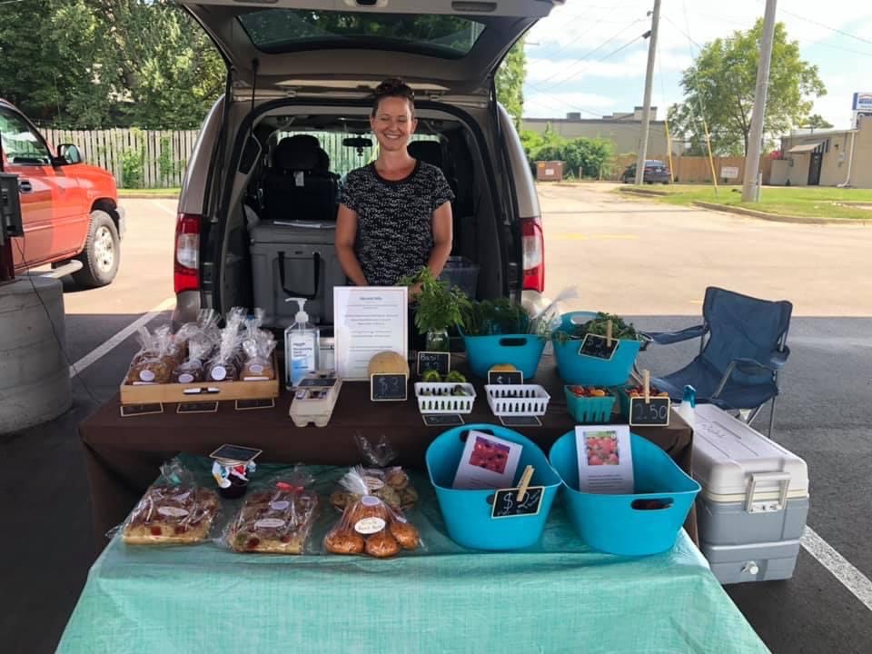 Shelly from Harvest Hills Farm - Standing at booth in the farmers' market